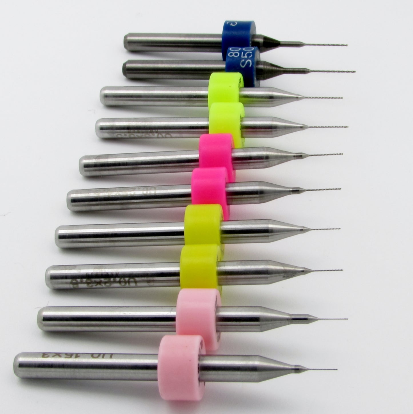 This convenient Solid Carbide Drill Set includes Two Pieces Each: .006" .008" .010" .012" .0135" Carbide Drills