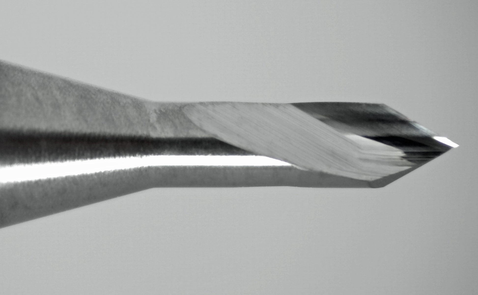 close-up of 1/16 inch 60 degree spiral V-bit engraver tip showing dual flute cutting edges