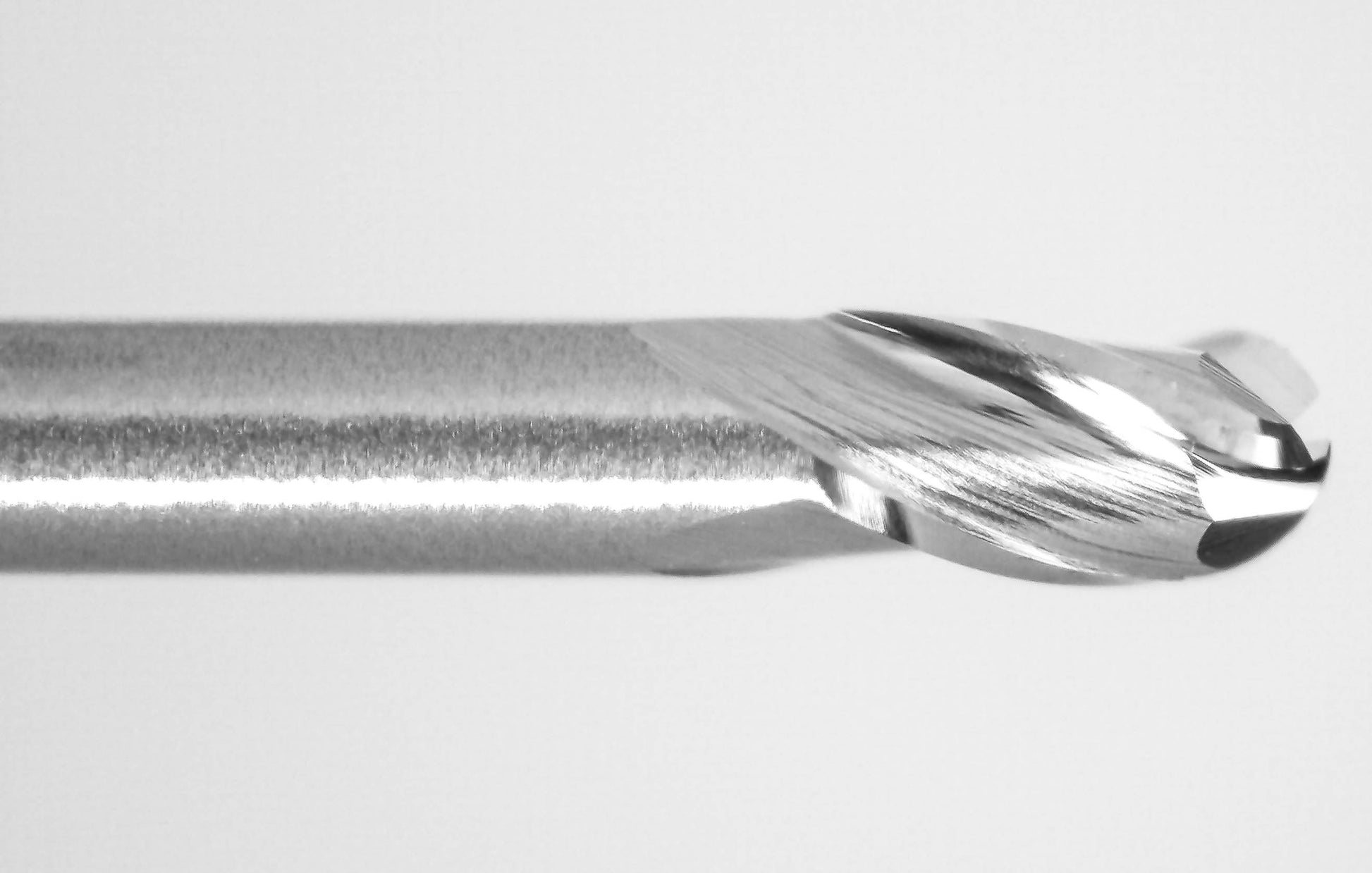 cutting tip close up of 0.030 inch 3 flute carbide ball nose end mill Kyocera 1755-0300.375