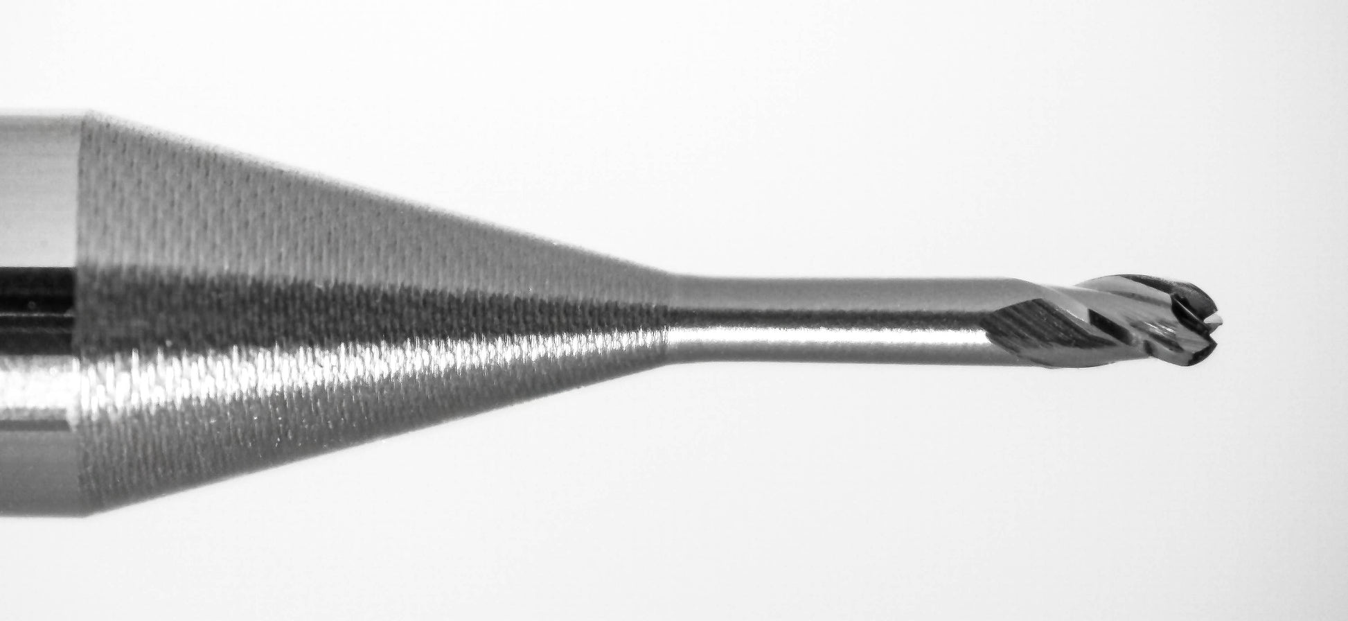 Close-up of Kyocera 0.030 inch ball nose end mill tip with AlTiN coating