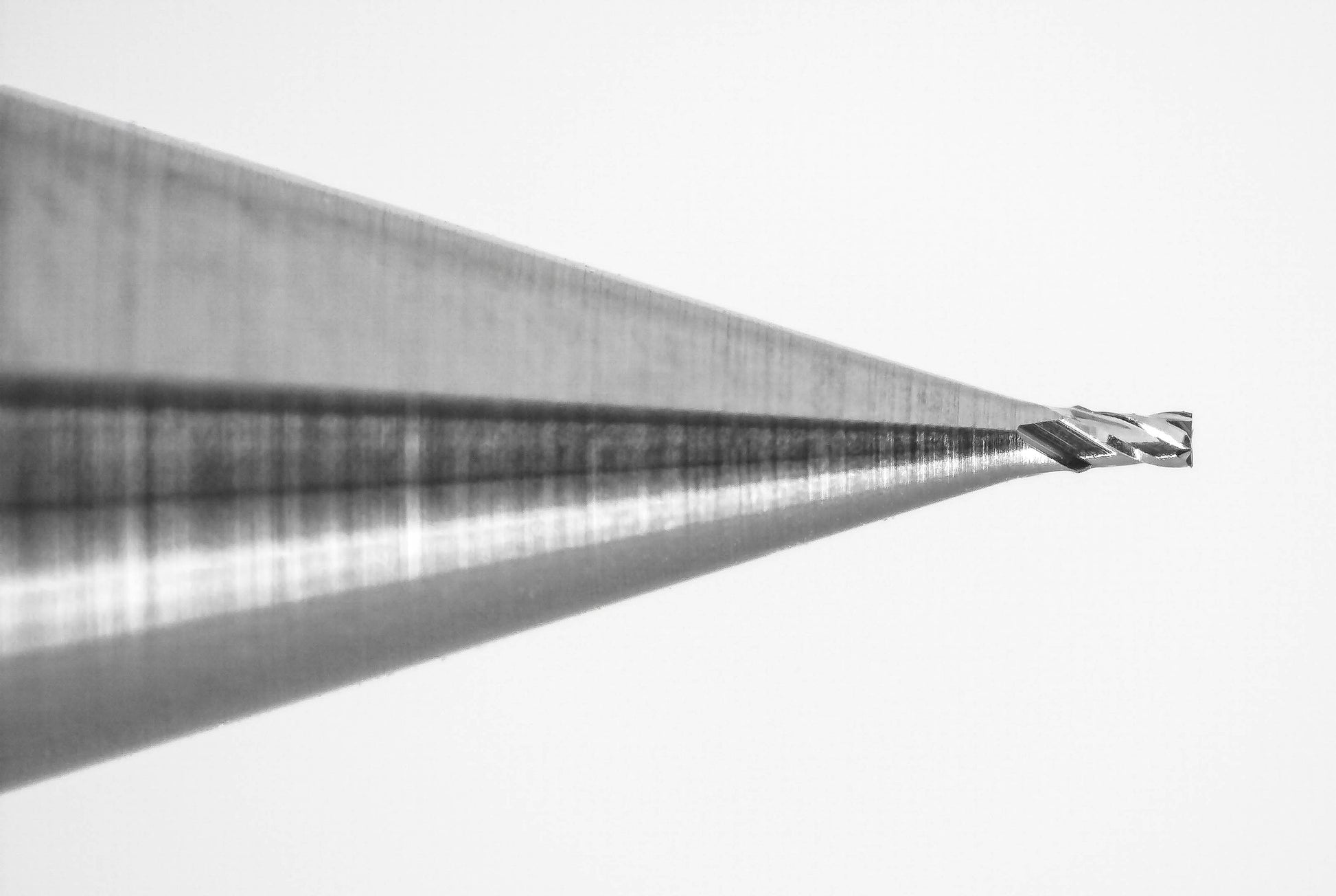 Close-up of Kyocera 0.25mm 4 flute square end mill cutting tip