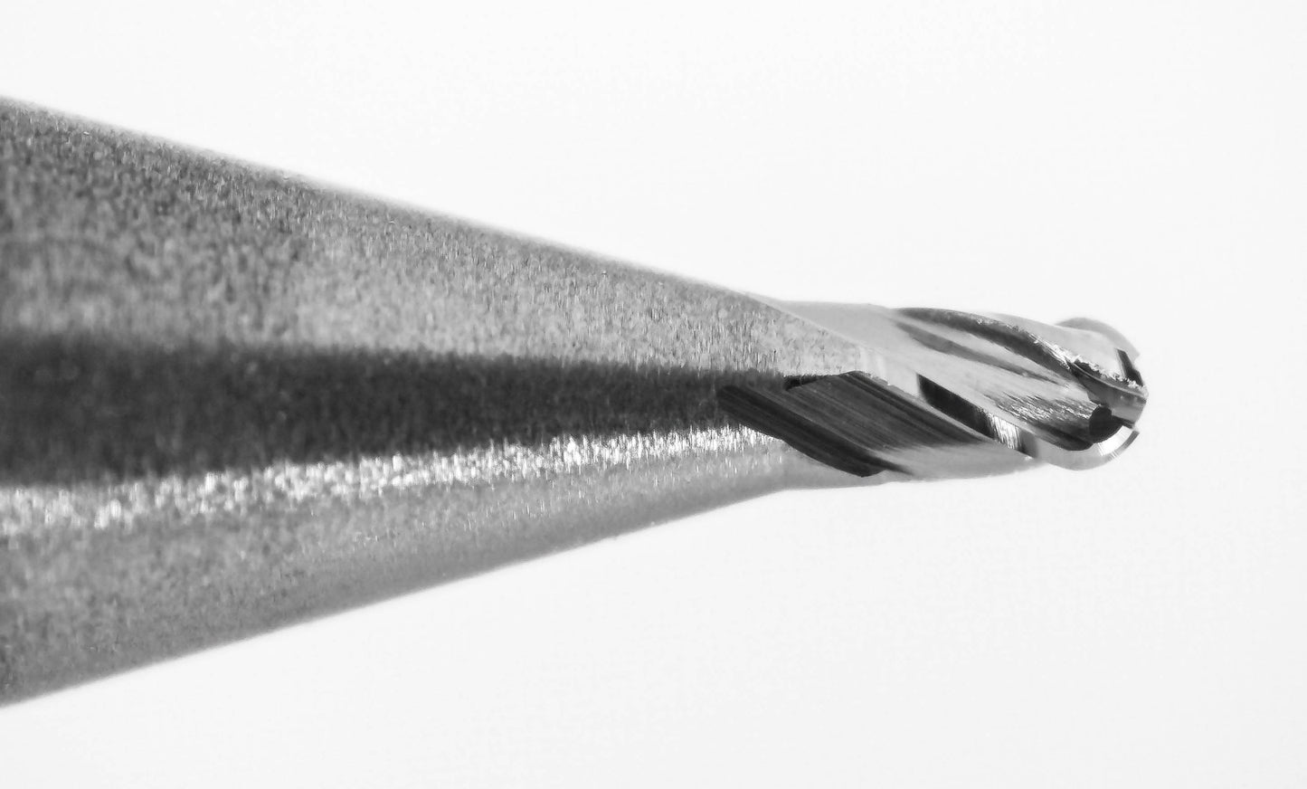 cutting tip close up of 0.036 inch 4 flute carbide ball nose end mill Kyocera 1835-0360.054