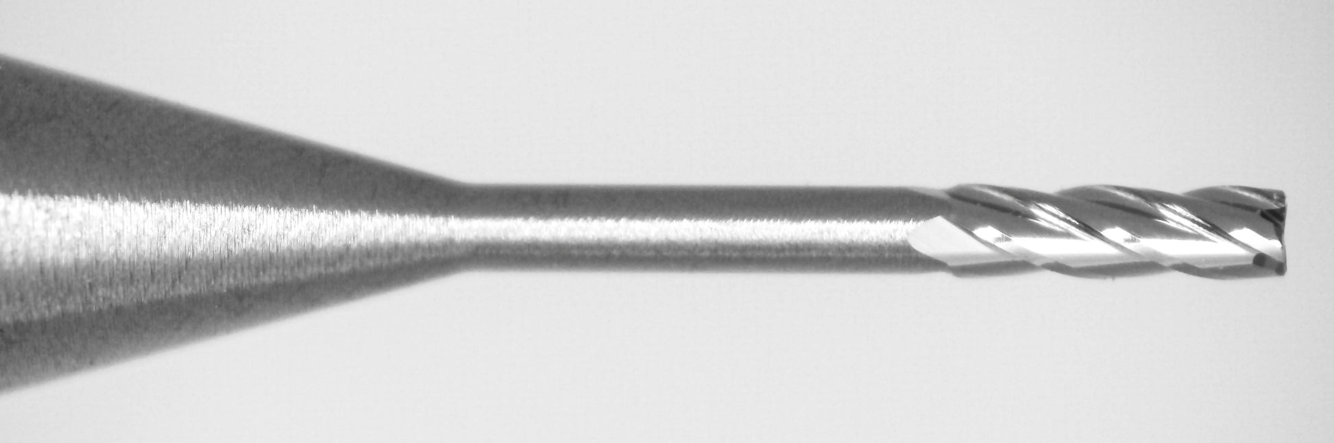 Close-up of Kyocera 0.0250 inch 4 flute square end mill tip with extended reach geometry