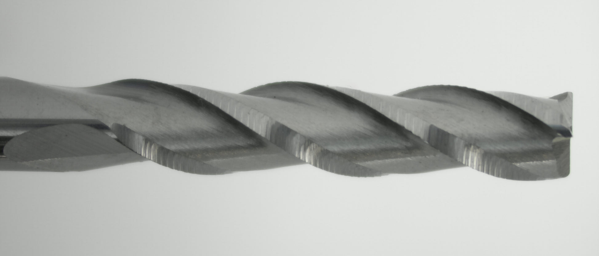 close up 3 flute carbide end mill cutting edges
