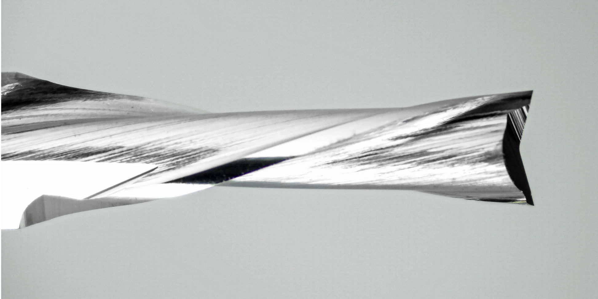 downcut carbide end mill cutting edge close-up fish tail tip