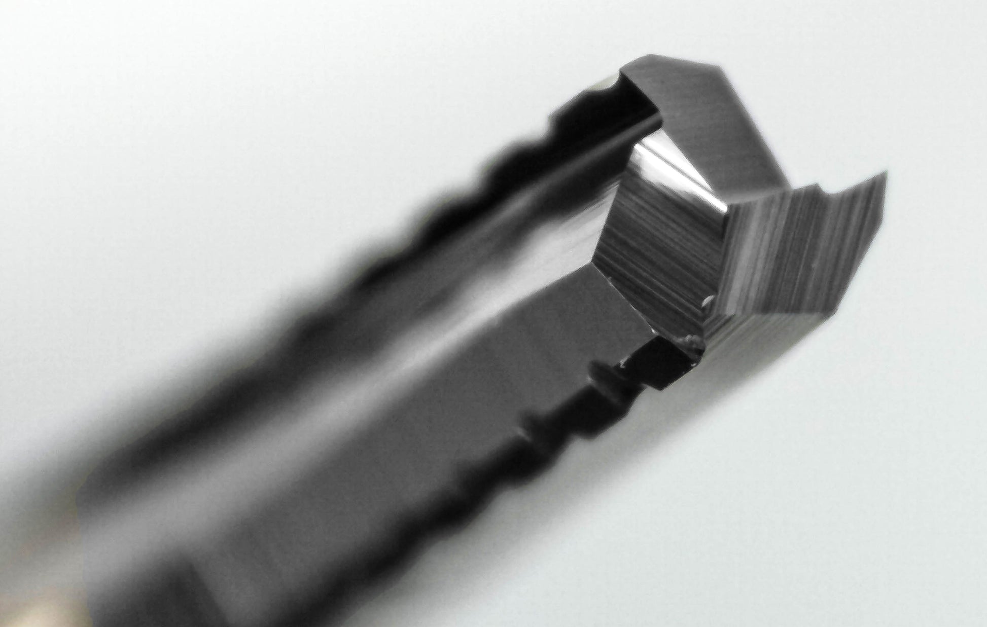 serrated chip breaker roughing end mill cutting edges close up