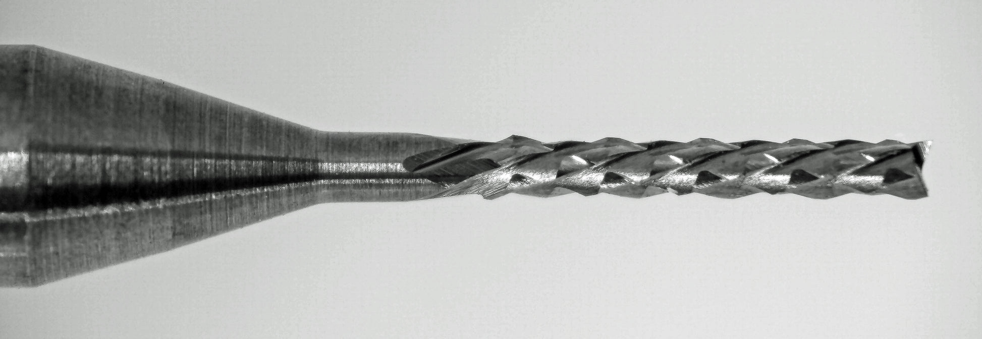 close up of fish tail tip on 1/32 diamond flute carbide router down cut