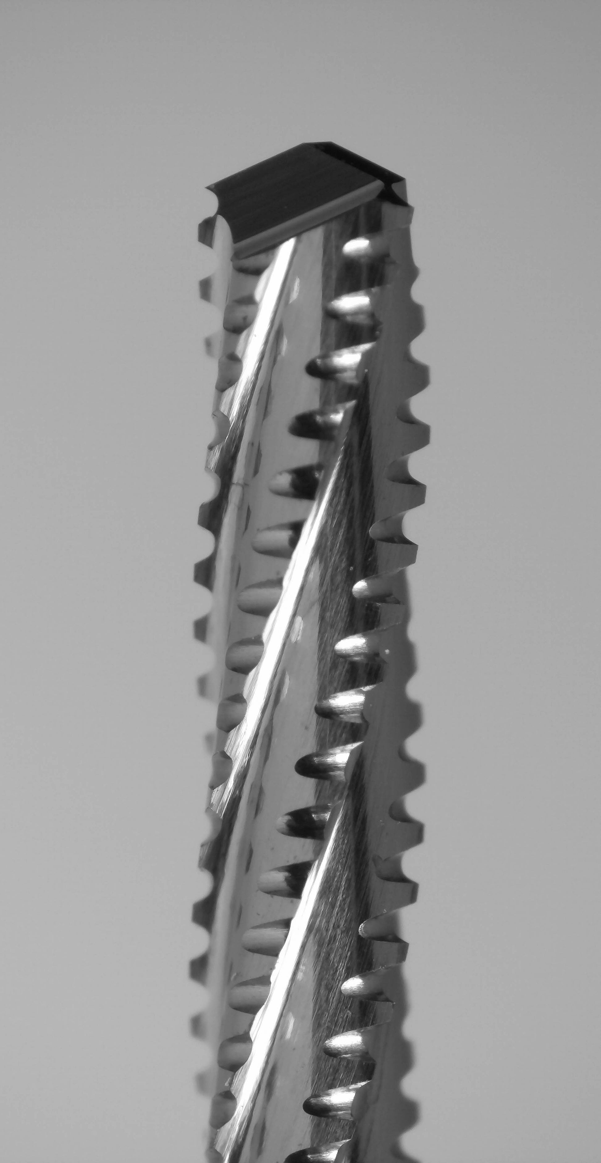 Drill point tip detail on 1/16 inch chip breaker carbide router