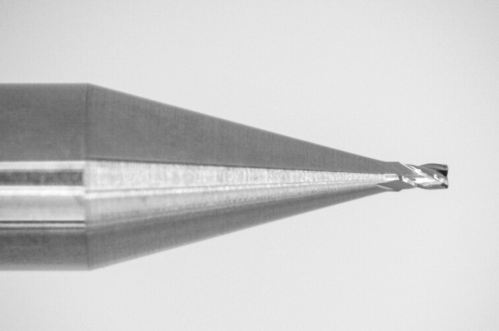 Close-up of cutting end on Kyocera .0180 inch 4-flute uncoated stub-length square end carbide end mill