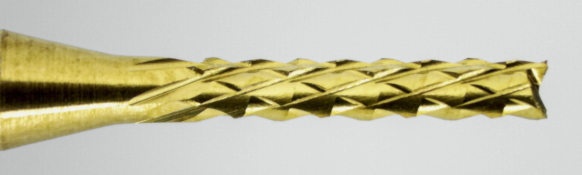 Close-up of fish tail tip and down cut diamond pattern flutes on 1/16 TiN coated carbide router bit